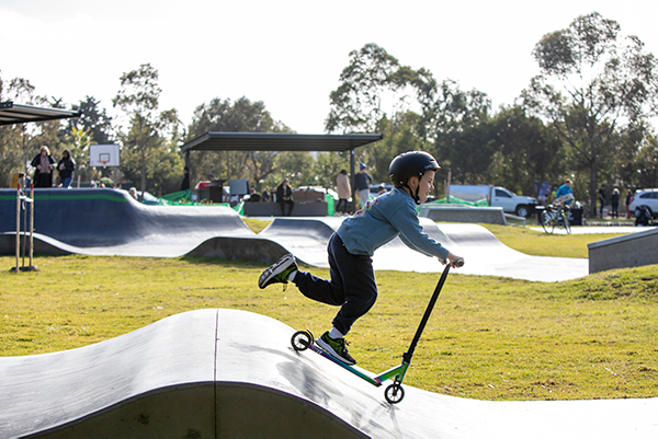 Child on scooter at skate park