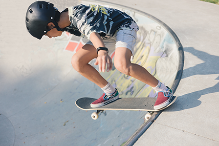 skateboarder on rim of skate bowl